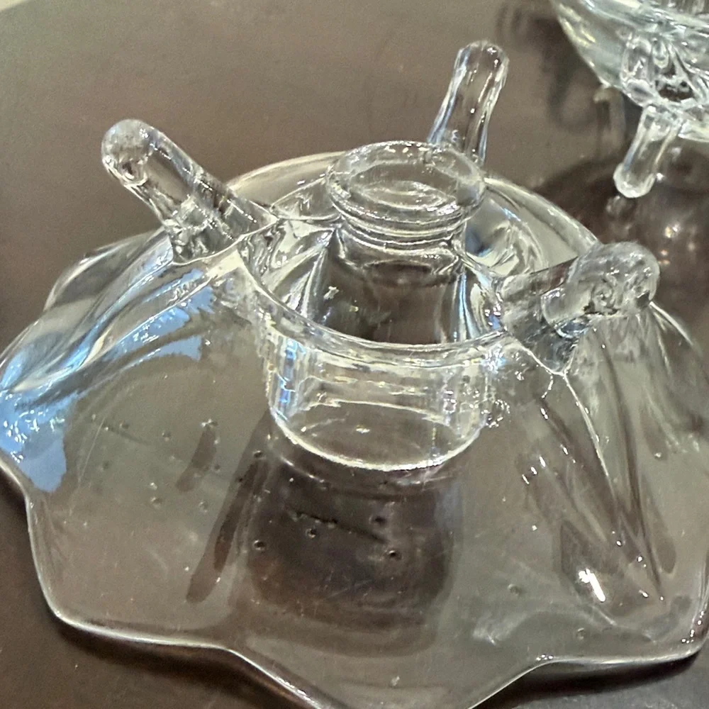 Vintage Art Glass 3-Toed Candle Holder with flower-like scalloped edge.